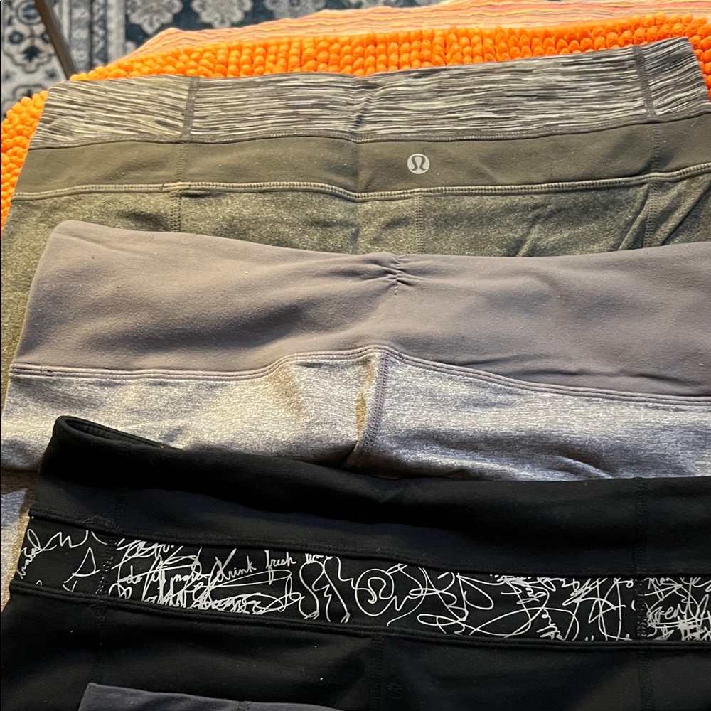 lululemon knee length Women’s Capri’s - Black, Gray, and Dark Gray. Four pairs.